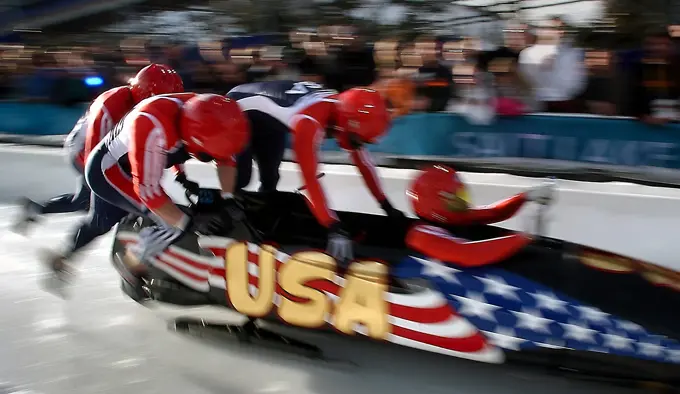 (Right to left) Pilot Brian Shimer, World Class Athletes SPECIALIST Mike Kohn, USA, and SPECIALIST Doug Sharp, USA, with brakeman Dan Steele sprint down the start at the Utah Olympic Park track in Park City, Utah, during their first run of the men's four-man bobsled in the 2002 WINTER OLYMPIC GAMES. Subject Operation/Series: 2002 WINTER OLYMPIC GAMES Base: Park City State: Utah (UT) Country: United States Of America (USA)