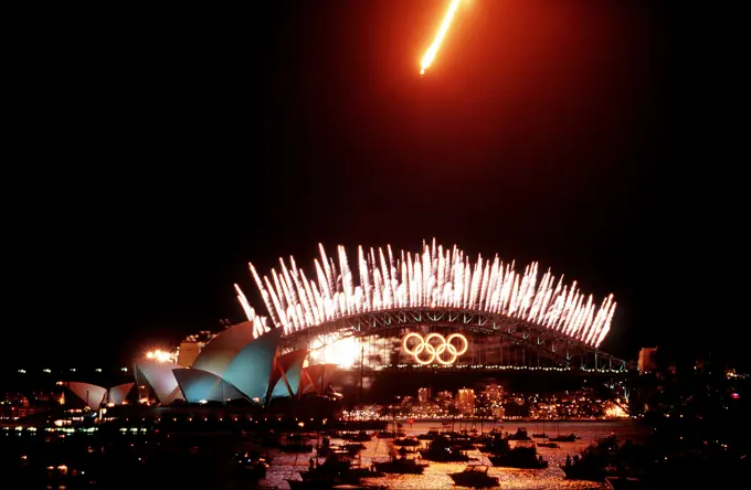 A US Air Force F-111 Aardvark aircraft, with it's after burner on, clears the Sydney Harbour Bridge during closing ceremonies of the 2000 Olympics games in Sydney, Australia. Base: Sydney State: New South Wales Country: Australia (AUS)