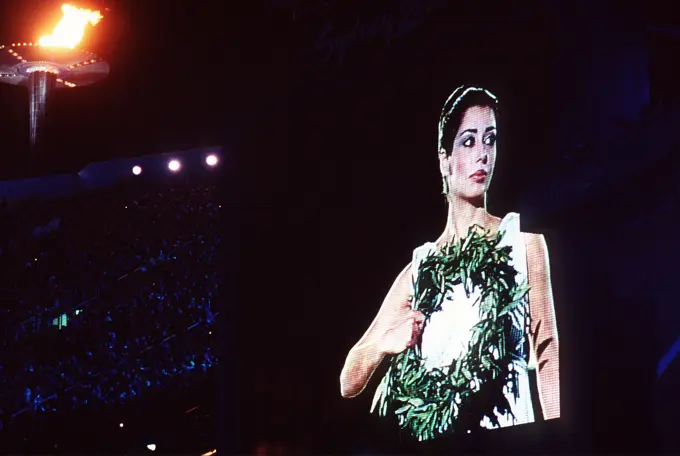 An"Olympic Goddess"is shown on a television screen at Olympic Stadium during closing ceremonies on the last day of the 2000 Olympics in Sydney, Australia. Fifteen US Department of Defense personnel participated in the Olympics, from coaches and support staff to athletes competing in various venues. An "Olympic Goddess" is shown on a television screen at Olympic Stadium during closing ceremonies on the last day of the 2000 Olympics in Sydney, Australia.  Fifteen US Department of Defense personnel participated in the Olympics, from coaches and support staff to athletes competing in various venues.