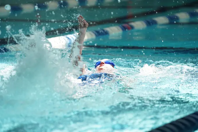 A Special Olympics Mississippi athlete competes in a swimming event at the Biloxi Natatorium in Biloxi, Mississippi, during the SOMS Summer Games, May 14, 2022. Keesler Air Force Base, Mississippi, hosted the Summer Games, and swimming events were held at Sandhill Ranch.