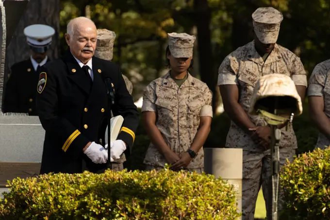 Retired Fire Captain Jeff Williams with the City of Jacksonville Fire Department, leads a prayer during the Patriot Day Observance Ceremony at Lejeune Memorial Gardens in Jacksonville, North Carolina, Sept. 9, 2022. The Patriot Day ceremony is held in remembrance of the Sept. 11 terrorist attacks and a tribute to those who made the ultimate sacrifice.