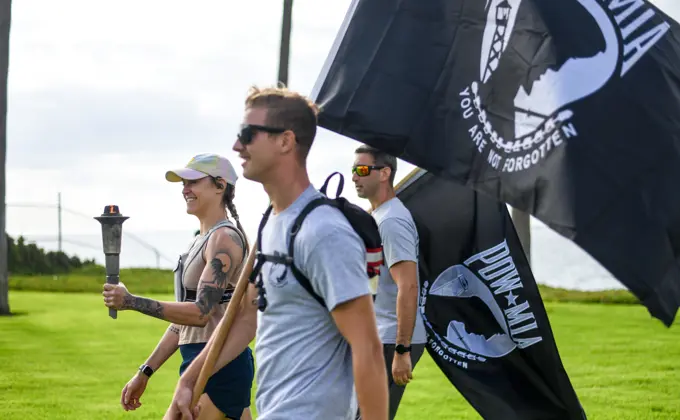 Los Angeles Air Force Base held a remembrance event for National POW/MIA Recognition Day that began on Sept. 15 and ended on Sept. 16 with a 54 mile torch run and wreath laying ceremony.  The torch lighting and run began at Terminal Island, California, and ended at the base. Various base and community organizations carried the torch while running relay legs. The Los Angeles Air Force Base honor guard presented the colors for the opening ceremony on Sept. 16, 2022. Col. Mia Walsh, Commander of Space Base Delta 3, hands the Most Miles Completed trophy to volunteers and the top runners.