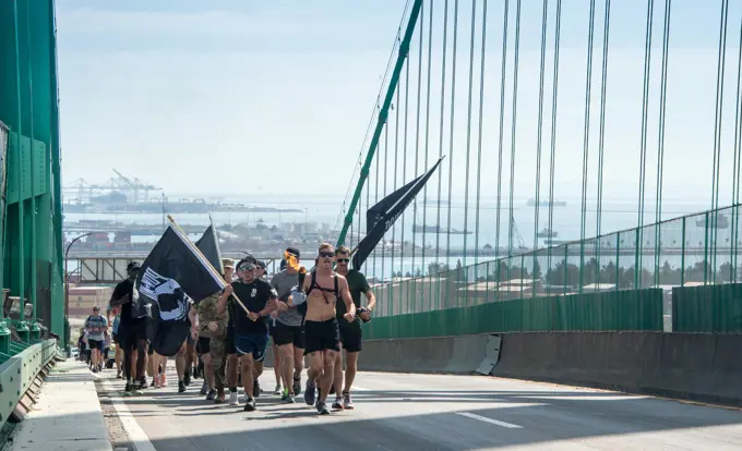 Los Angeles Air Force Base held a remembrance event for National POW/MIA Recognition Day that began on Sept. 15 and ended on Sept. 16 with a 54 mile torch run and wreath laying ceremony.  The torch lighting and run began at Terminal Island, California, and ended at the base. Various base and community organizations carried the torch while running relay legs. The Los Angeles Air Force Base honor guard presented the colors for the opening ceremony on Sept. 16, 2022. Col. Mia Walsh, Commander of Space Base Delta 3, hands the Most Miles Completed trophy to volunteers and the top runners.