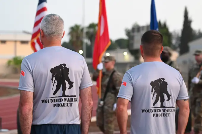 Col. Kevin McCaskey (left), 39th Air Base Wing vice commander, and Chief Master Sgt. Justin Stoltzfus, 39th ABW command chief, stand at attention during a POW/MIA remembrance ceremony at Incirlik Air Base, Turkey, Sept. 16, 2022. Service members and civilians gathered for a 24-hour run in honor of National POW/MIA Recognition Day. Attendees continued to run until the end of the event to remember and honor those Americans who were prisoners of war and those who served and never returned home.