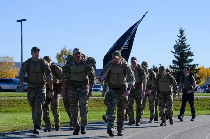 U.S. Airmen assigned to the 3rd Air Support Operations Squadron participate in the Prisoners of War/Missing in Action remembrance run on Eielson Air Force Base, Alaska, Sept. 16, 2022. The run was in observance of National POW/MIA Recognition Day, a day honoring service members who are still missing or were prisoners of war.