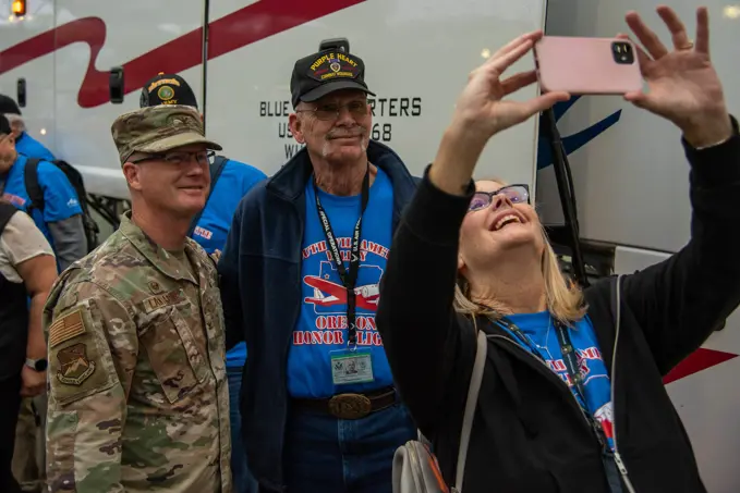 Col. Christopher Lantagne, 142nd Wing Vice Commander, poses for a photo with a Vietnam veteran, at Portland International Airport (PDX), September 30th, 2022, Portland, Ore. 142nd Wing leadership, along with members of the United States Coast Guard, were present to send off a group of 56 veterans departing to Washington D.C. as part of the Honor Flight Program. The Honor Flight Program was initiated in 2005, and provides roundtrip flights and chaperones to veterans wishing to visit various war memorials in Washington D.C.