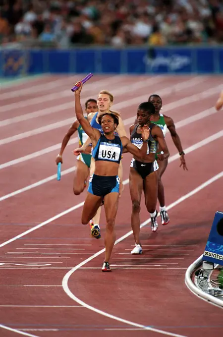 La Tasha Colander-Richardson, the wife of a US Army soldier crosses the finish line in first place during the Woman's 4X400 Relay Finals on Saturday, September 30th, 2000 at the 2000 Sydney Olympic Games. Base: Sydney State: New South Wales Country: Australia (AUS)