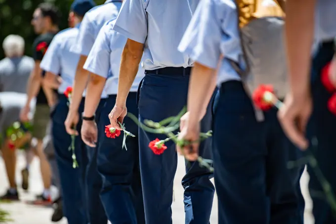 Visitors participate in the first Flowers of Remembrance Day at the Tomb of the Unknown Soldier at Arlington National Cemetery, Arlington, Va., May 28, 2022. Visitors were given the opportunity to cross the plaza and place a flower in front of the Tomb of the Unknown Soldier. This event pays homage to the first official Decoration Day, now known as Memorial Day, which originally took place at the cemetery in 1868 as a way to honor the sacrifices of those who fought and died in the Civil War.