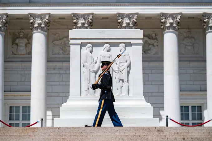 A tomb guard walks the mat during the first Flowers of Remembrance Day at the Tomb of the Unknown Soldier at Arlington National Cemetery, Arlington, Va., May 28, 2022. Visitors were given the opportunity to cross the plaza and place a flower in front of the Tomb of the Unknown Soldier. This event pays homage to the first official Decoration Day, now known as Memorial Day, which originally took place at the cemetery in 1868 as a way to honor the sacrifices of those who fought and died in the Civil War.