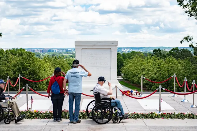 Veterans from an honor flight participate in the first Flowers of Remembrance Day at the Tomb of the Unknown Soldier at Arlington National Cemetery, Arlington, Va., May 28, 2022. Visitors were given the opportunity to cross the plaza and place a flower in front of the Tomb of the Unknown Soldier. This event pays homage to the first official Decoration Day, now known as Memorial Day, which originally took place at the cemetery in 1868 as a way to honor the sacrifices of those who fought and died in the Civil War.