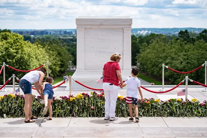 Visitors participate in the first Flowers of Remembrance Day at the Tomb of the Unknown Soldier at Arlington National Cemetery, Arlington, Va., May 28, 2022. Visitors were given the opportunity to cross the plaza and place a flower in front of the Tomb of the Unknown Soldier. This event pays homage to the first official Decoration Day, now known as Memorial Day, which originally took place at the cemetery in 1868 as a way to honor the sacrifices of those who fought and died in the Civil War.