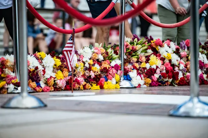 Visitors participate in the first Flowers of Remembrance Day at the Tomb of the Unknown Soldier at Arlington National Cemetery, Arlington, Va., May 28, 2022. Visitors were given the opportunity to cross the plaza and place a flower in front of the Tomb of the Unknown Soldier. This event pays homage to the first official Decoration Day, now known as Memorial Day, which originally took place at the cemetery in 1868 as a way to honor the sacrifices of those who fought and died in the Civil War.