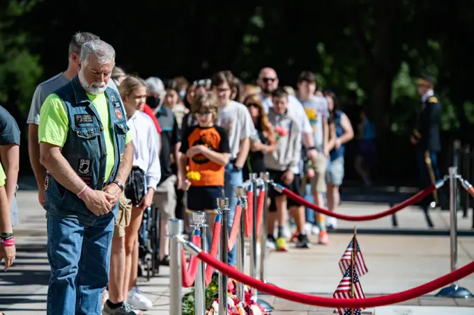 Visitors participate in the first Flowers of Remembrance Day at the Tomb of the Unknown Soldier at Arlington National Cemetery, Arlington, Va., May 28, 2022. Visitors were given the opportunity to cross the plaza and place a flower in front of the Tomb of the Unknown Soldier. This event pays homage to the first official Decoration Day, now known as Memorial Day, which originally took place at the cemetery in 1868 as a way to honor the sacrifices of those who fought and died in the Civil War.