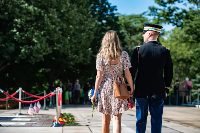 Visitors participate in the first Flowers of Remembrance Day at the Tomb of the Unknown Soldier at Arlington National Cemetery, Arlington, Va., May 28, 2022. Visitors were given the opportunity to cross the plaza and place a flower in front of the Tomb of the Unknown Soldier. This event pays homage to the first official Decoration Day, now known as Memorial Day, which originally took place at the cemetery in 1868 as a way to honor the sacrifices of those who fought and died in the Civil War.