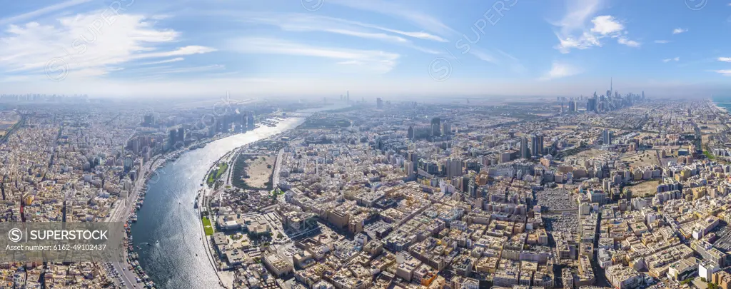 Panoramic aerial view of Dubai Creek and city skyline, Dubai, United Arab Emirates.