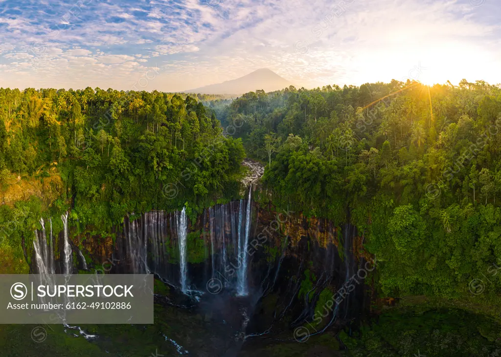 Panoramic aerial view of Tumpak Sewu Waterfall in sunny day, Indonesia