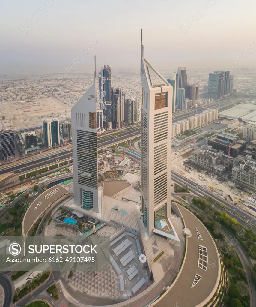 Aerial view of the Emirates Towers in misty Dubai, U.A.E.