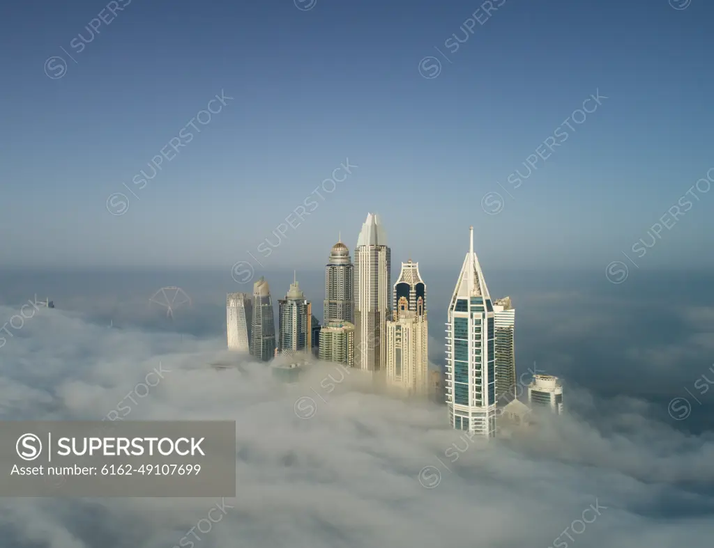 Aerial view of skyscrapers in the clouds of Dubai, U.A.E.