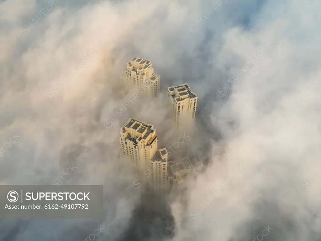 Aerial view of skyscrapers in the clouds of Dubai, U.A.E