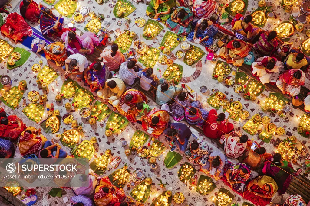 View of people celebrating Rakher festival before the fasting break eating lot of things, Narayanganj, Bangladesh.