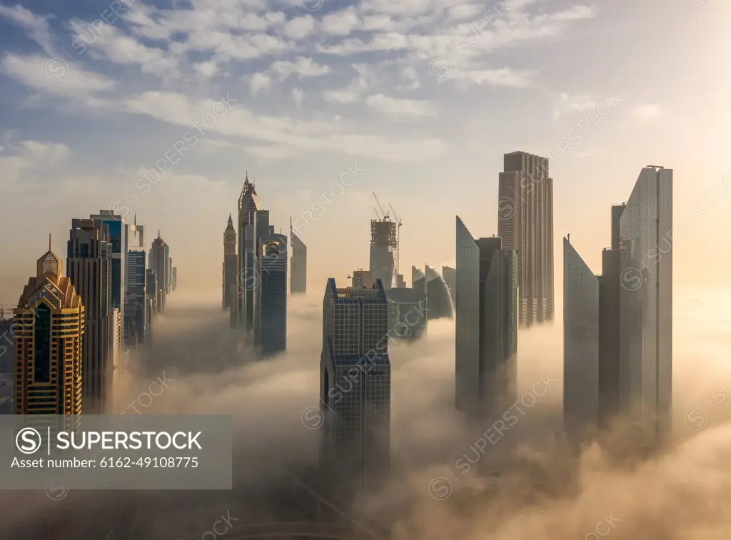 Aerial view of buildings surrounded by clouds Dubai, United Arab Emirates