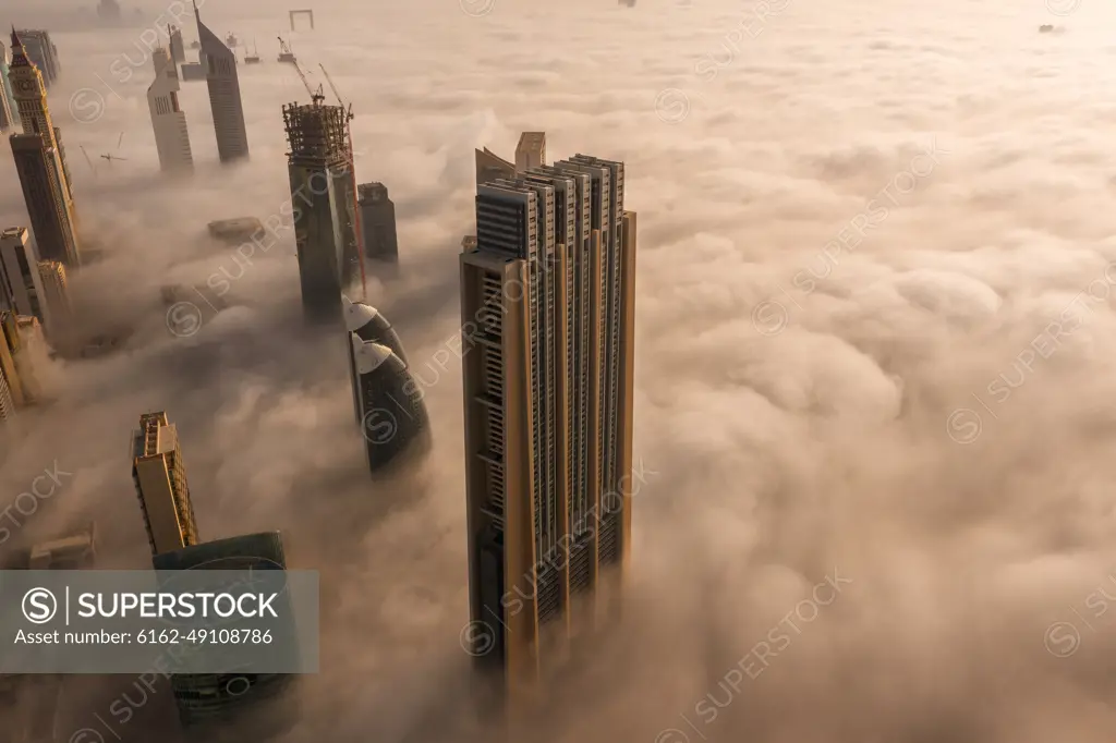 Aerial view of buildings surrounded by clouds Dubai, United Arab Emirates