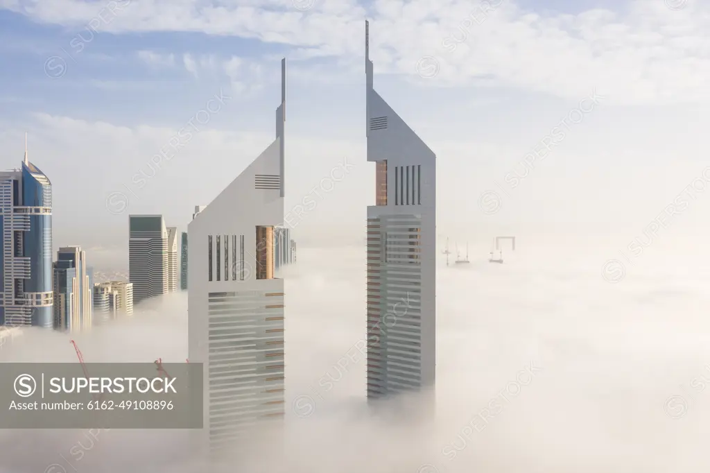 Aerial view of buildings surrounded by clouds Dubai, United Arab Emirates