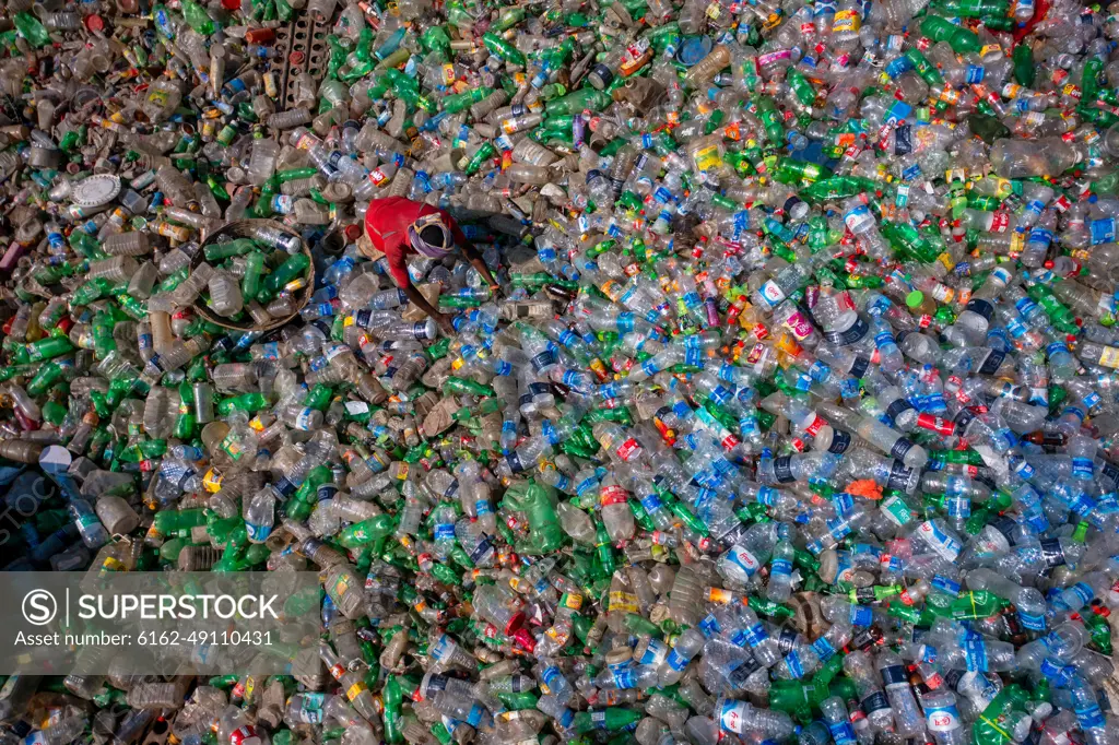 Dhaka, Bangladesh - 06 November 2022: Aerial view of a person working in a plastic Waste treatment plant, Dhaka, Bangladesh.