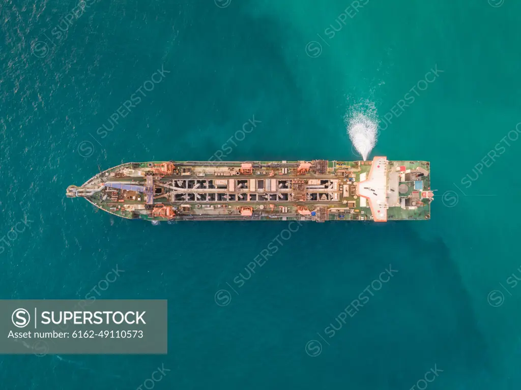 Aerial view of sand dredging boat in Persian Gulf, Dubai, UAE.