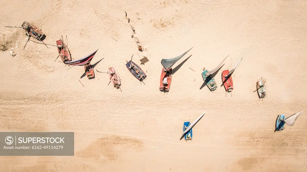 Aerial view of traditional fishing boats on the beach in Brazil.