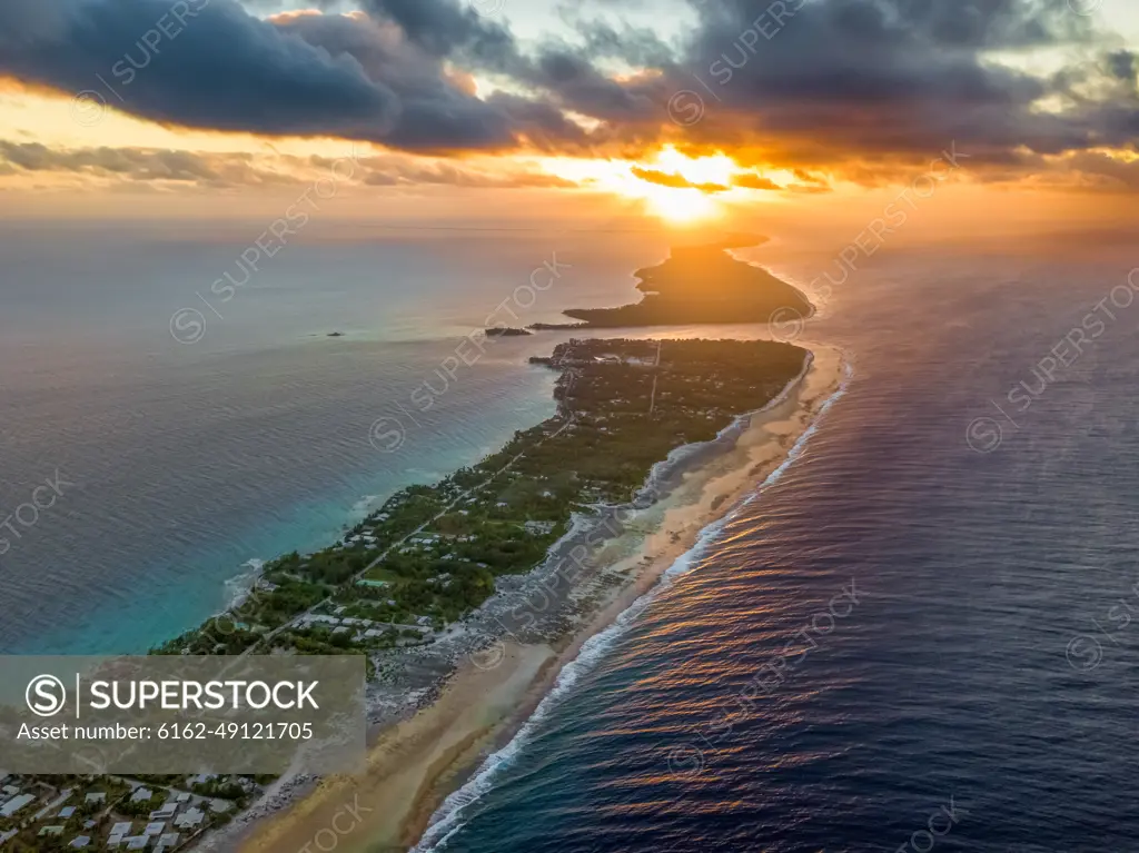 Aerial view of one of the largest atolls in the world, Rangiroa atoll at sunset in Tahiti.