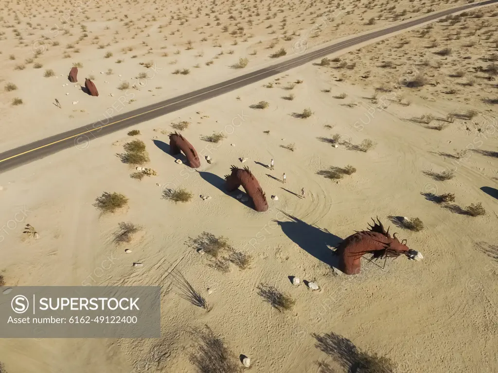 Aerial view of friends at Dragon sculpture in californian desert in Borrego Springs, USA.