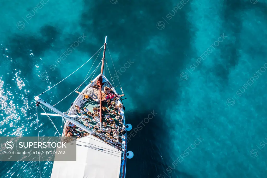 Tisno, Croatia - 9AUGUST 2019: Aerial view of a boat in the turquoise waters