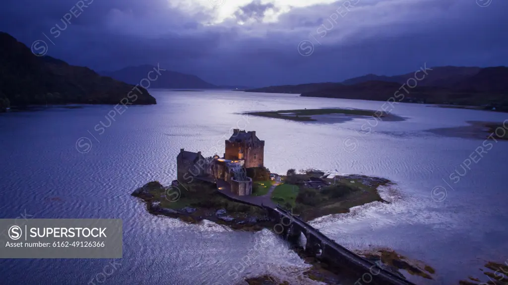 Aerial view of dusk at famous Aielan Donan castle near Dornie in Scotland.