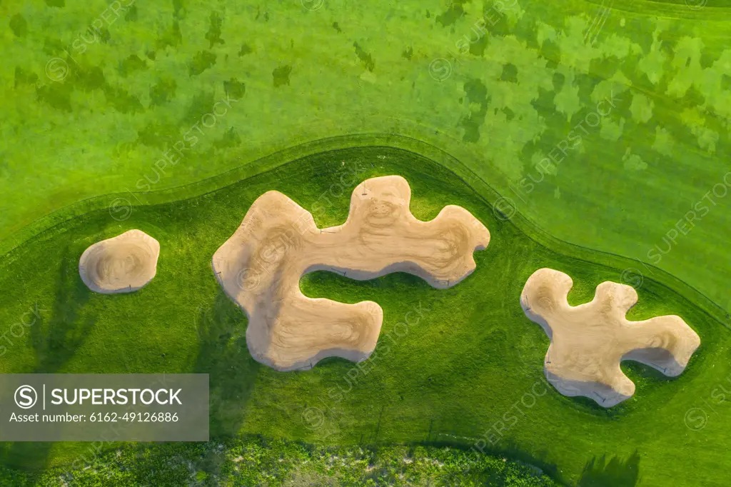 Aerial view of a golf course fairway and sand traps in early spring creating an abstract looking perspective at the Cantigny Golf Course in Wheaton, IL - USA