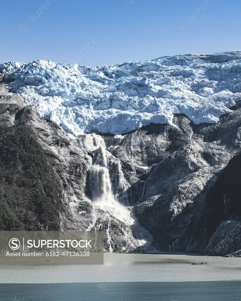 View of the mountain peaks with snow along the fjords in Antarctic region of Chile, Patagonia, Chile.