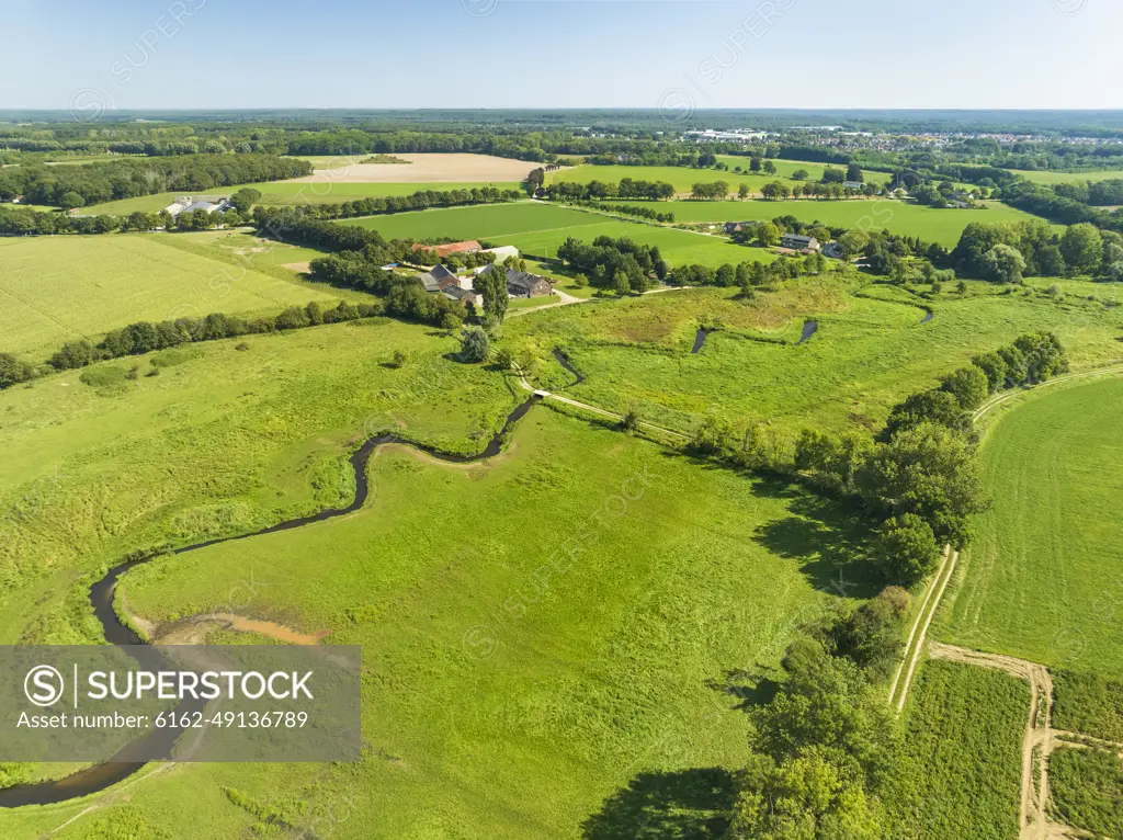 Aerial view of small meandering river Swalm in stream valley Swalmdal, Swalmen, Limburg, Netherlands.