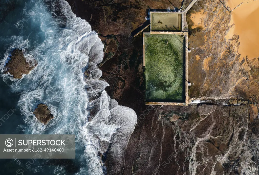 Aerial view of a natural rock pool along Robert Dunn Reserve coastline, Moan Vale, New South Wales, Sydney, Australia.