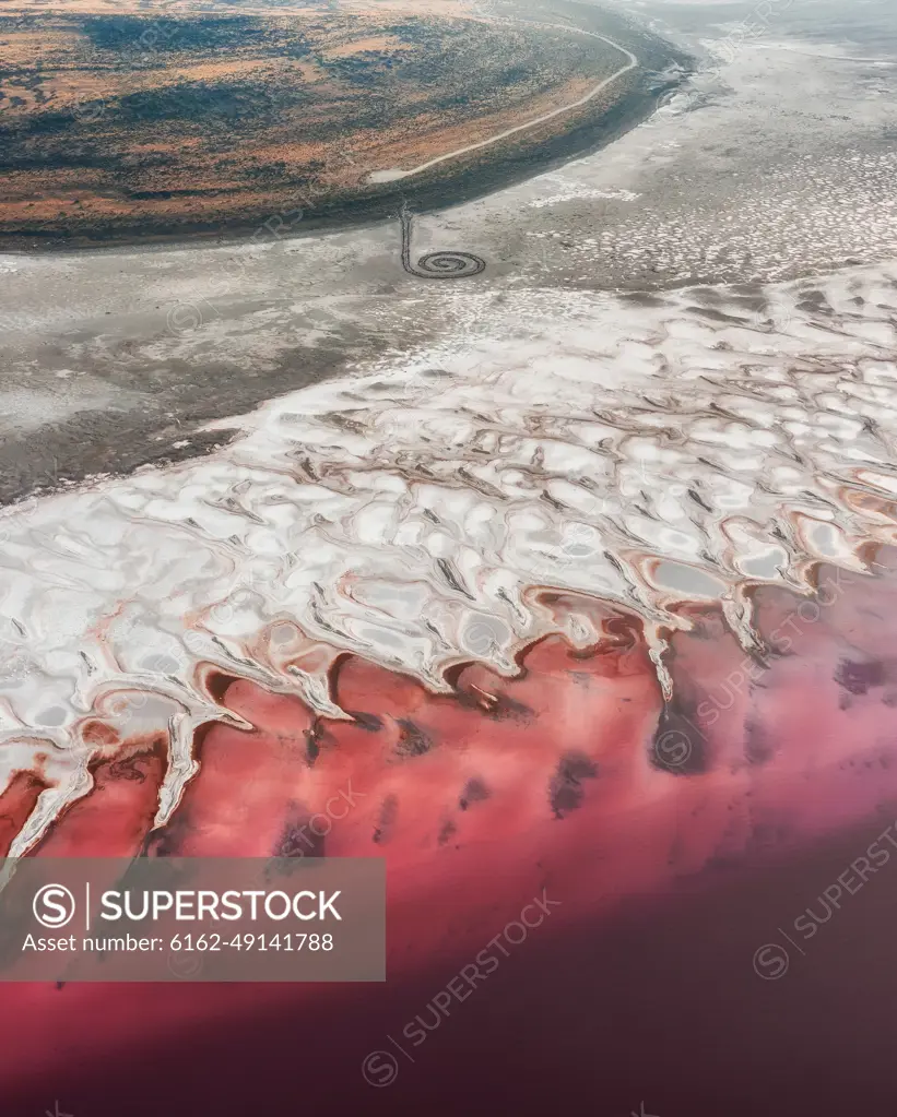 Aerial View of the famous earthwork sculpture made on the banks of the Great Salt Lake by Robert Smithson in the 1970 named the Spiral Jetty in Utah, USA