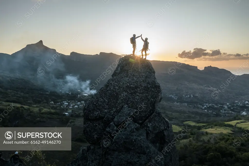 Aerial view of people climbing on Piton Jacob Peak mountain in Port Louis, Mauritius.