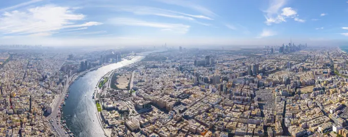 Panoramic aerial view of Dubai Creek and city skyline, Dubai, United Arab Emirates.