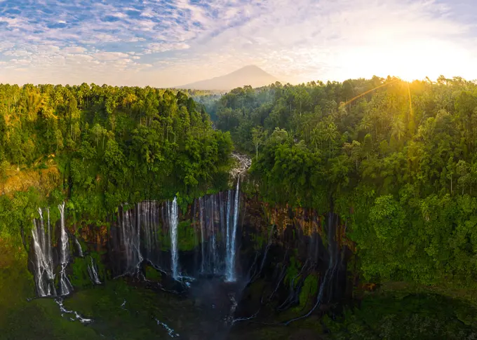 Panoramic aerial view of Tumpak Sewu Waterfall in sunny day, Indonesia