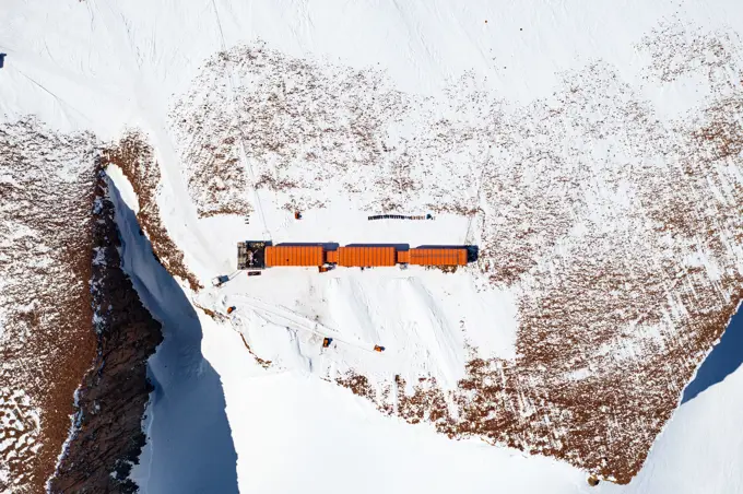 Aerial view of SANAE IV base surrounded by snow in Antarctica