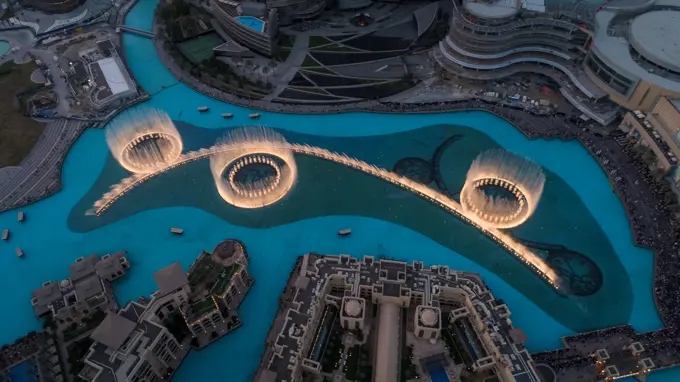 Aerial view of the illuminated Dubai fountain at night in United Arab Emirates.