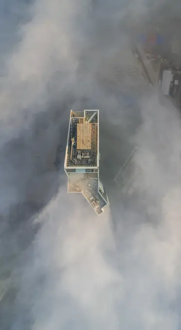 Aerial view of skyscrapers in the clouds of Dubai, U.A.E