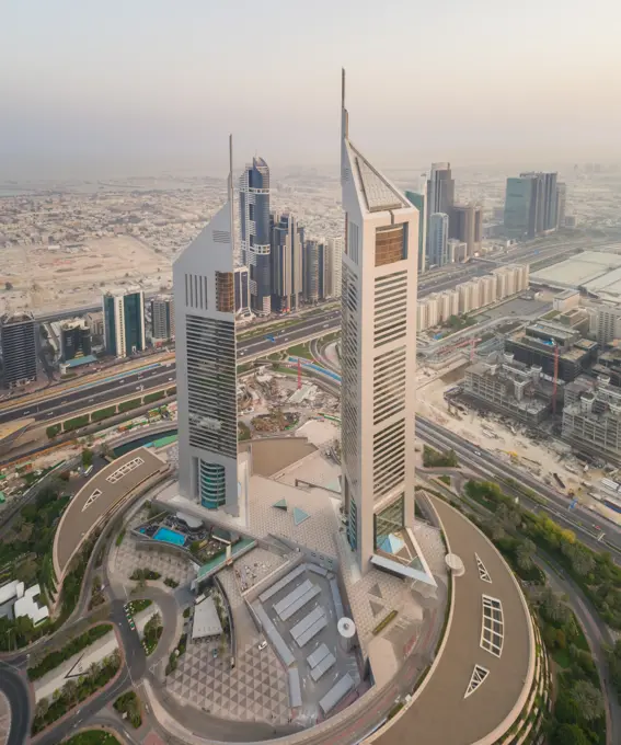 Aerial view of the Emirates Towers in misty Dubai, U.A.E.