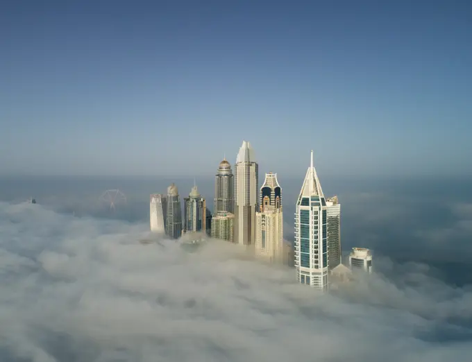 Aerial view of skyscrapers in the clouds of Dubai, U.A.E.