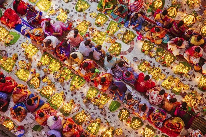 View of people celebrating Rakher festival before the fasting break eating lot of things, Narayanganj, Bangladesh.