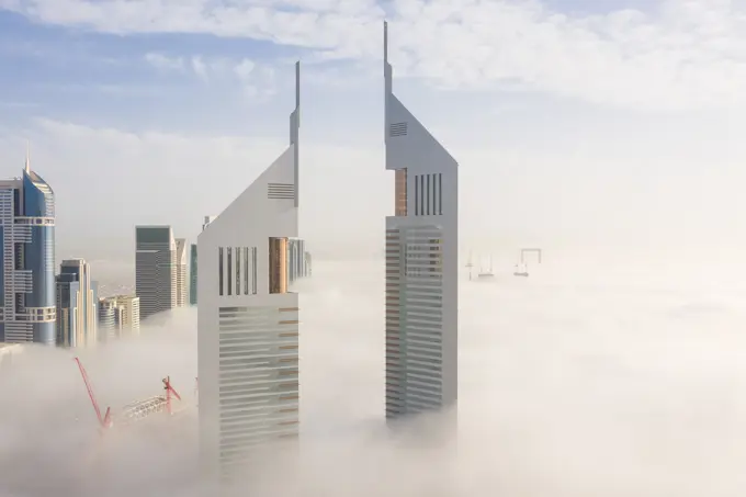 Aerial view of buildings surrounded by clouds Dubai, United Arab Emirates