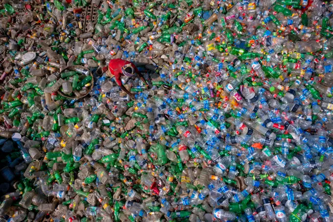 Dhaka, Bangladesh - 06 November 2022: Aerial view of a person working in a plastic Waste treatment plant, Dhaka, Bangladesh.